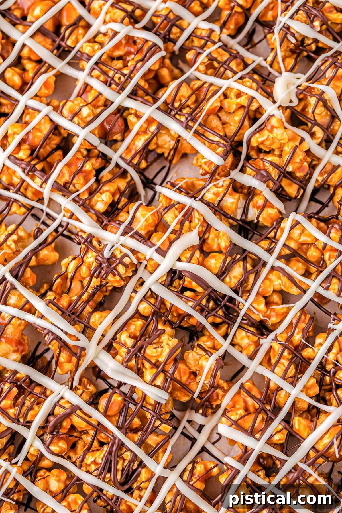 top down close up view of zebra popcorn recipe showing the chocolate drizzles on top of the caramel corn.