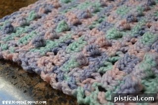 Crochet Patterns for Cozy Doll Blankets 5 Detailed view of variegated crochet doll blanket pattern