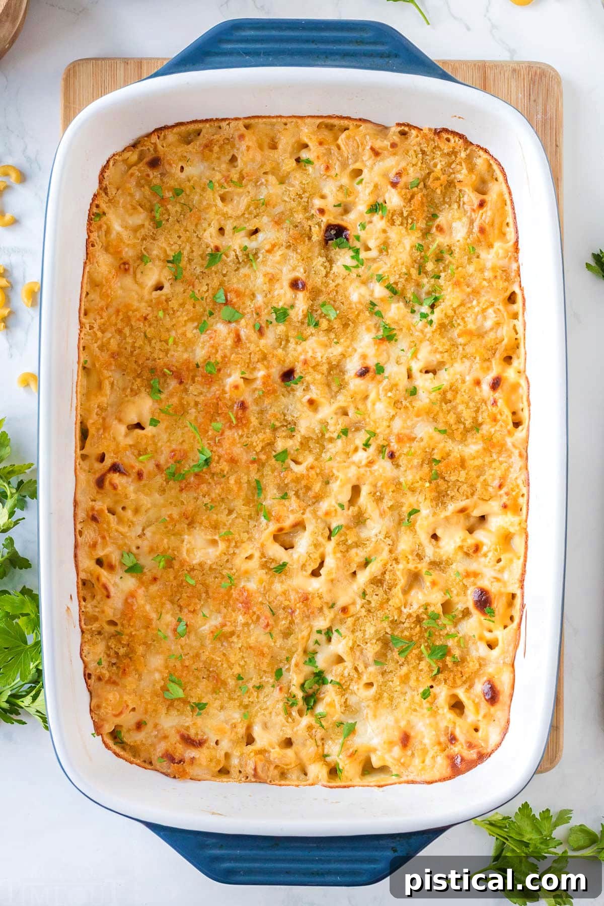 Top-down view of Velveeta Mac and Cheese in a casserole dish, garnished with fresh parsley.