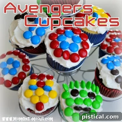 Close-up of Captain America, Thor, and Iron Man cupcakes with M&Ms