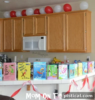 Dr. Seuss books displayed as part of the party decor