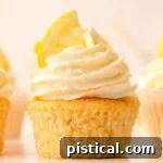 Zesty Lemon Delight Cupcakes 10 Side view of a lemon cupcake.