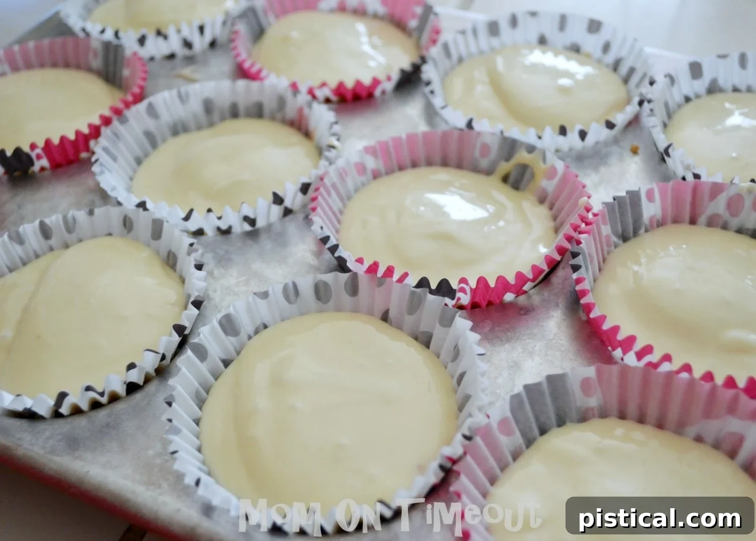 Baked mini cheesecakes with Reese's Peanut Butter Cups in a muffin pan.