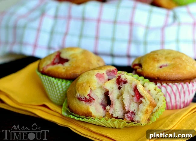 A beautifully arranged batch of freshly baked Strawberry & Cream Cheese Muffins on a cooling rack, ready to be enjoyed. #muffintime #homemade #dessert