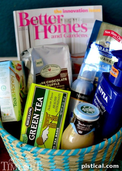 A curated Mother's Day gift basket featuring homemade coffee sugar scrub alongside other pampering treats like chocolate, tea, and a magazine.
