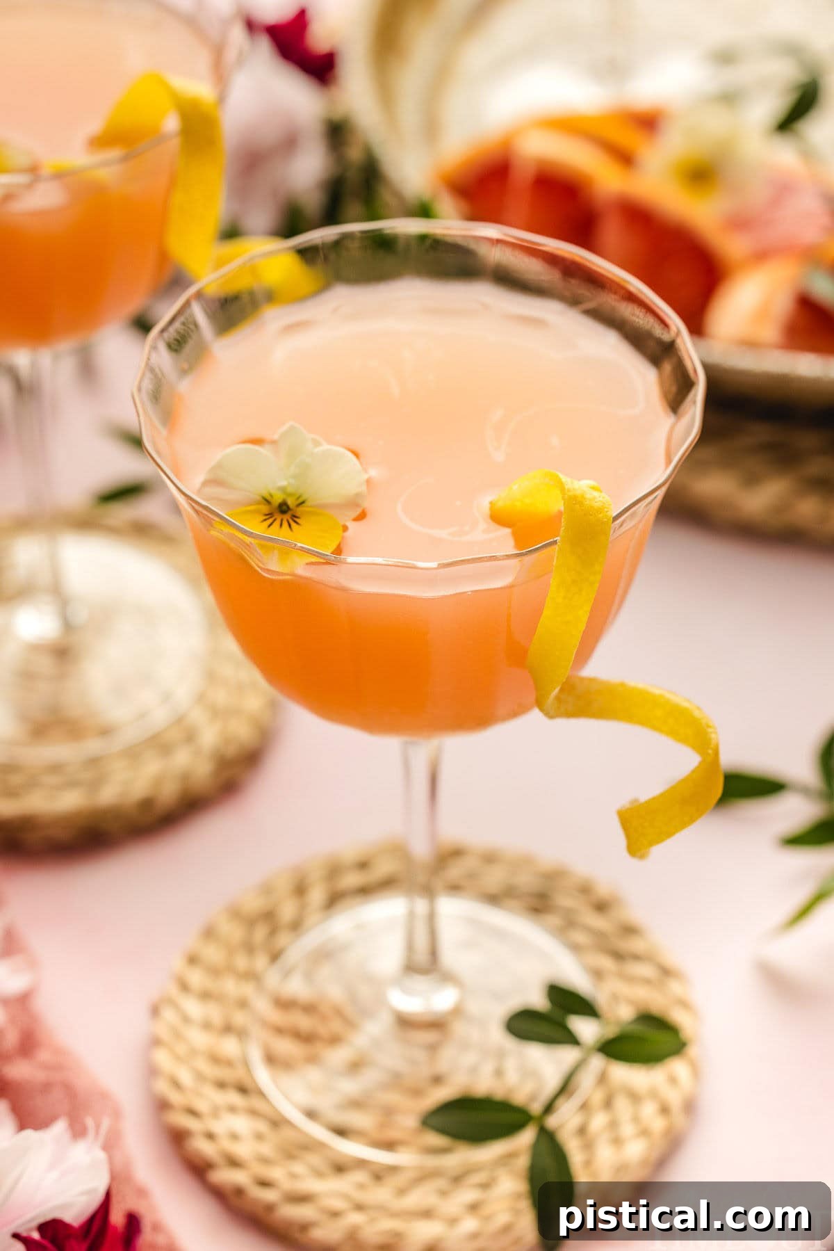 French Blonde Cocktail in a glass with garnishes.