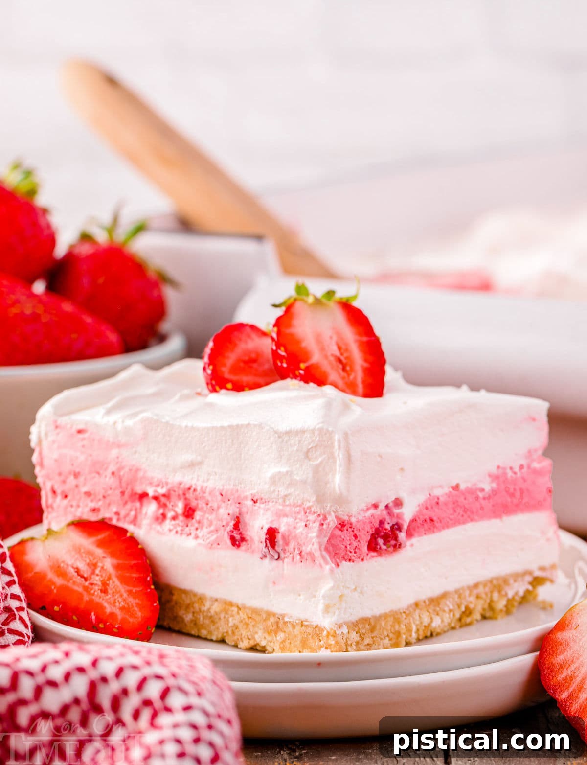 Layered Strawberry Dream 7 A slice of strawberry lasagna on a white plate.