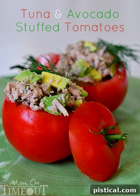A vibrant plate of Tuna and Avocado Stuffed Tomatoes, showcasing their freshness and appeal as a healthy lunch or appetizer.