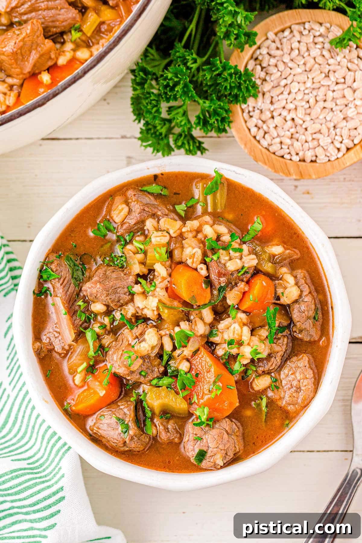 Hearty Beef Barley Stew 6 A top down view of a bowl of beef and barley soup.