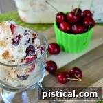 A vibrant image of Cherry Cheesecake Magic Ice Cream, highlighting its creamy texture and rich cherry and graham cracker inclusions.