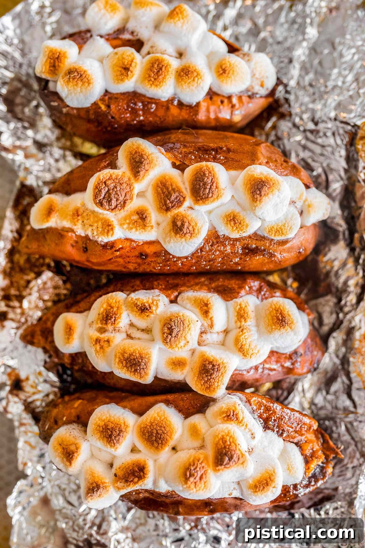 Twice baked sweet potatoes on a piece of aluminum foil.