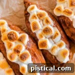 Close up shot of twice baked sweet potatoes on a piece of parchment paper.