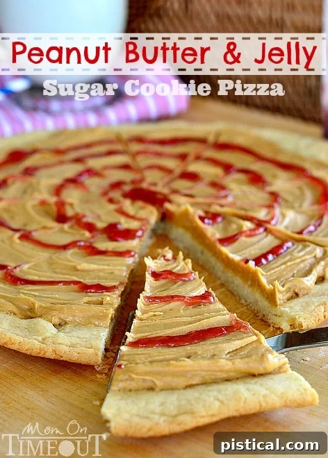 Peanut Butter and Jelly Sugar Cookie Pizza - Inspired by #Disney! from MomOnTimeout.com Peanut Butter and Jelly Sugar Cookie Pizza, a delightful dessert inspired by Goofy's Kitchen at Disneyland, featuring a soft sugar cookie crust, creamy peanut butter frosting, and a sweet jelly swirl. Perfect for Disney enthusiasts and dessert lovers.