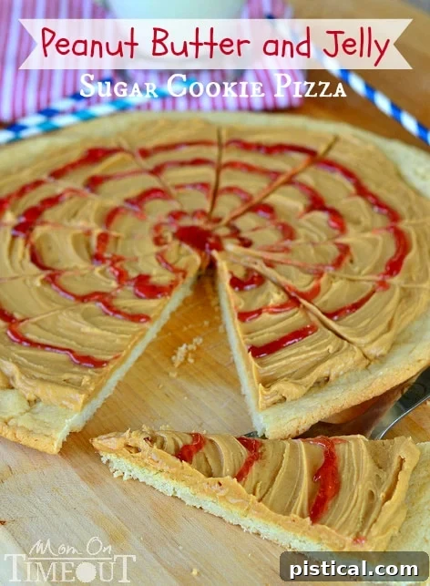 Peanut Butter and Jelly Sugar Cookie Pizza - Inspired by #Disney! from MomOnTimeout.com A tempting close-up of a single slice of Peanut Butter and Jelly Sugar Cookie Pizza, highlighting its layered deliciousness and inviting texture.