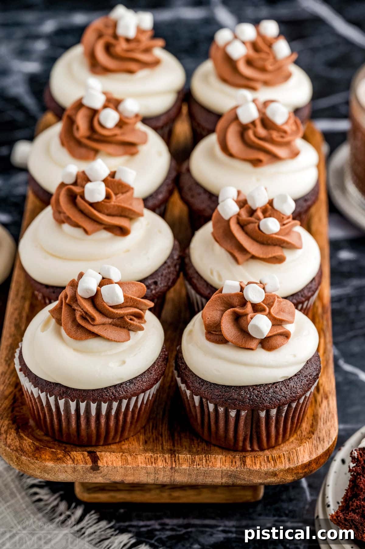 Velvet Hot Chocolate Cupcakes 3 Hot chocolate cupcakes lined up neatly on a serving tray, ready to be enjoyed.
