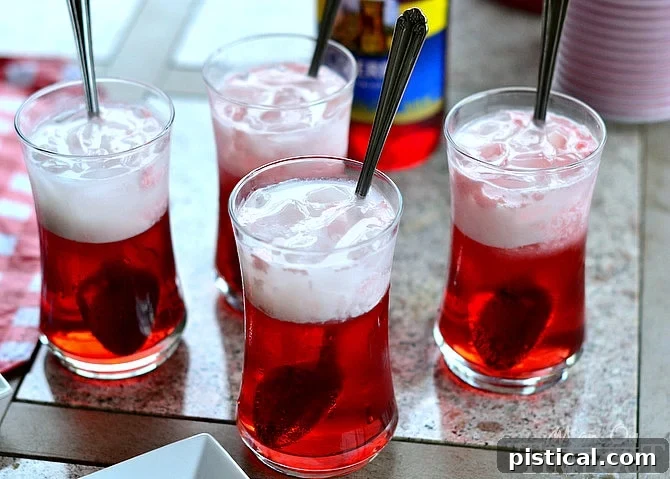 Best Cherry Italian Cream Soda Close-up of a Cherry Italian Cream Soda with ice, showcasing the beautiful color gradient.