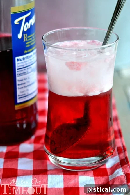 Simple Italian Cream Soda Recipe Ingredients laid out for Cherry Italian Cream Soda preparation: syrup, cream, club soda, and ice.