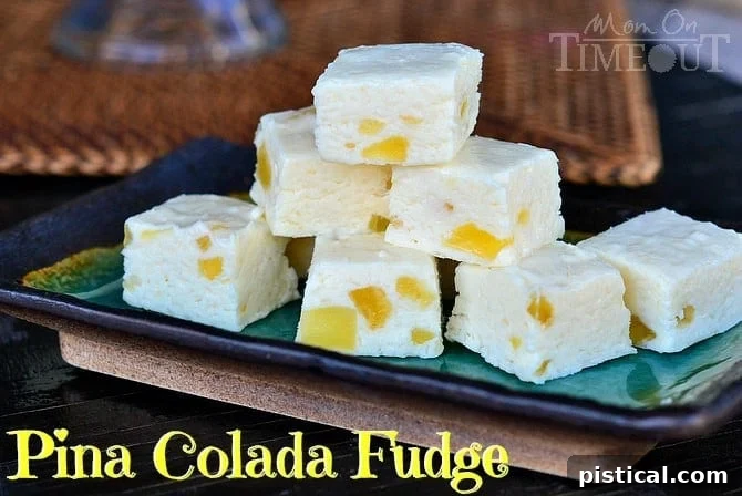 Close-up of creamy Pina Colada Fudge, showcasing the smooth texture and a hint of coconut, ready to be sliced. A perfect treat for coconut lovers.
