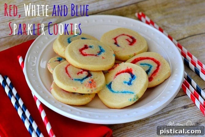 Baked Red, White, and Blue Sparkler Cookies cooling on a wire rack.