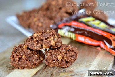 Pile of easy chocolate no-bake cookies with oatmeal, coconut, and Heath bar pieces.