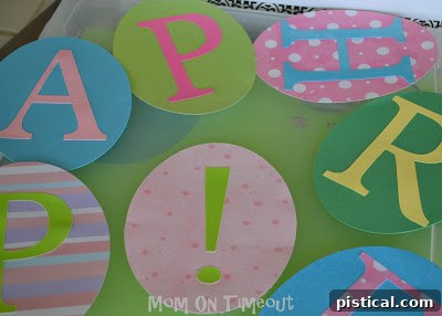 DIY Festive Easter Egg Banner 5 Punching ribbon slots into paper eggs