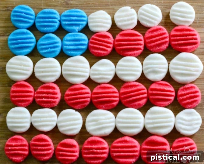 Red, White, and Blue Peppermint Patties: Easy and Fun for All Occasions! A selection of patriotic peppermint patties, showcasing their distinct red, white, and blue colors, neatly arranged on a festive plate for a holiday gathering.