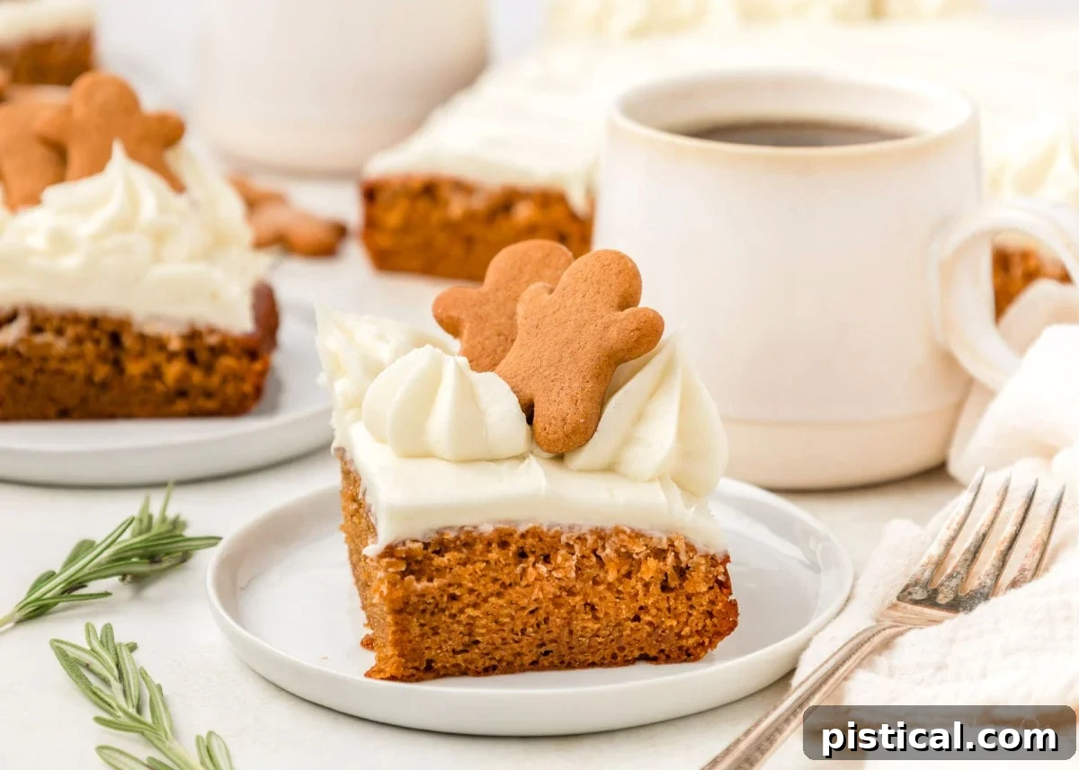 A perfectly portioned slice of gingerbread cake, elegantly topped with miniature gingerbread men, resting on a clean white plate.