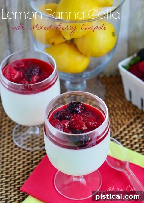 Luscious Lemon Panna Cotta topped with colorful Mixed Berry Compote in a clear glass, a perfect summer treat.