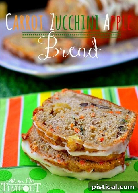 Incredibly moist and flavorful Carrot Zucchini Apple Bread with visible shreds of carrot and zucchini and chunks of apple. Perfect for a healthy breakfast or snack.