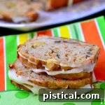 A delicious slice of Carrot Zucchini Apple Bread, showcasing its moist texture.