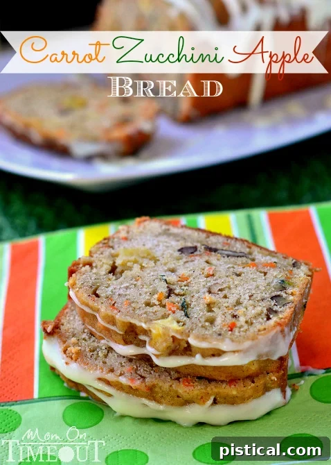 Close-up of a beautifully sliced Carrot Zucchini Apple Bread loaf, revealing the moist interior and colorful ingredients.