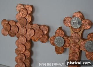 Coin-covered cross with a second layer of nickels added for enhanced dimension and visual contrast