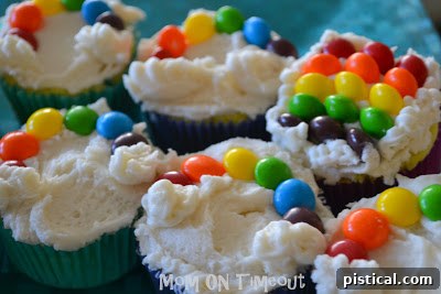 Finished Taste the Rainbow Cupcake with a vibrant Skittles rainbow and fluffy marshmallow clouds
