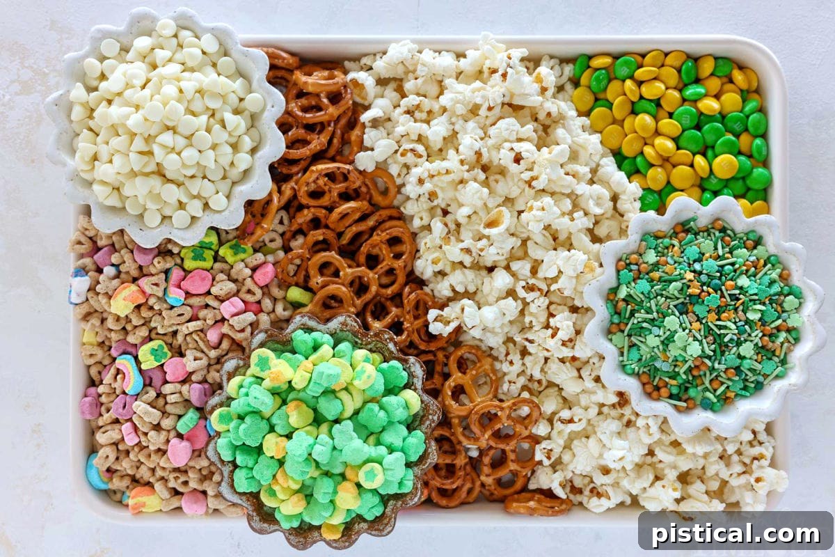 Ingredients for leprechaun bait recipe on sheet tray organized into rows.