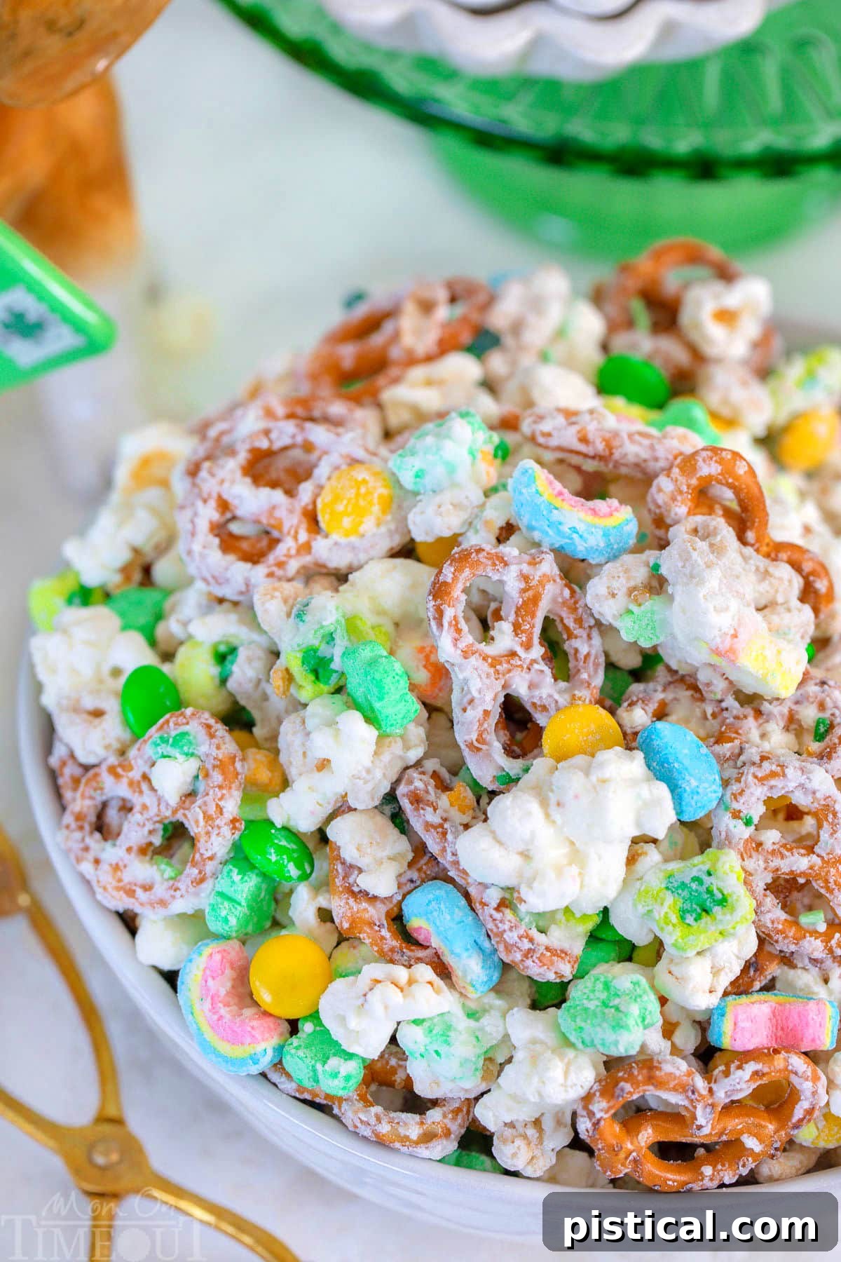 Close up look at Leprechaun Bait in white bowl with green cake stand in background.