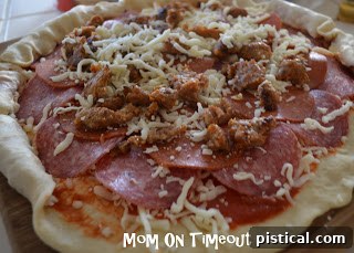 The process of crimping and sealing the stuffed pizza crust.