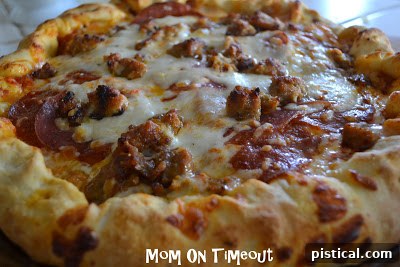 A freshly baked meat lover's stuffed crust pizza, golden and bubbly.