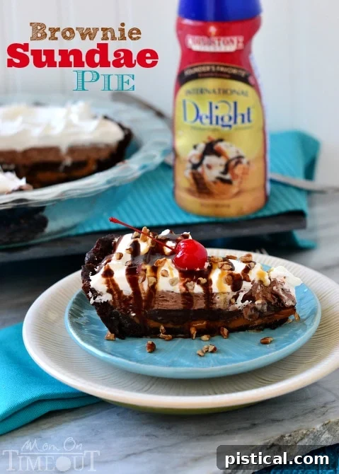 Perfectly Sliced Brownie Sundae Pie Recipe A perfectly sliced Brownie Sundae Pie with a clear view of all its delicious layers, ready to be enjoyed.