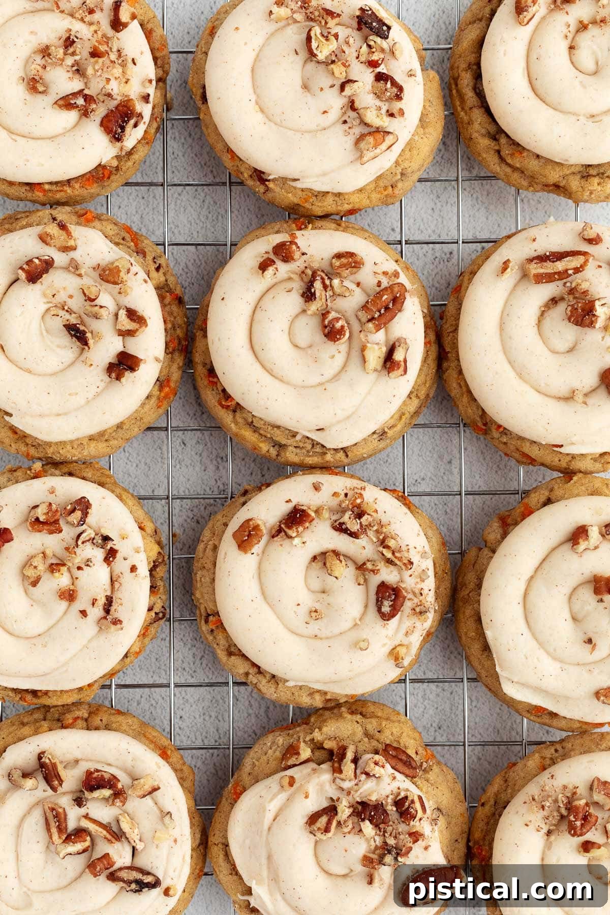 Cream Cheese Frosted Carrot Cookies 6 A row of delicious Carrot Cake Cookies cooling on a wire rack, perfectly baked and ready for their luscious frosting.