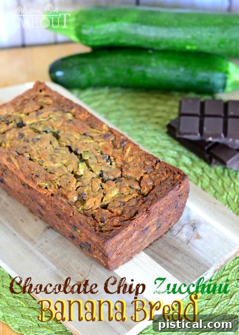A whole loaf of Chocolate Chip Zucchini Banana Bread, uncut, on a cooling rack.