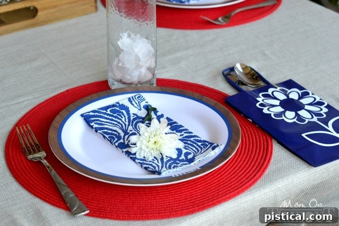 Elegant Labor Day place setting with a fresh flower accent