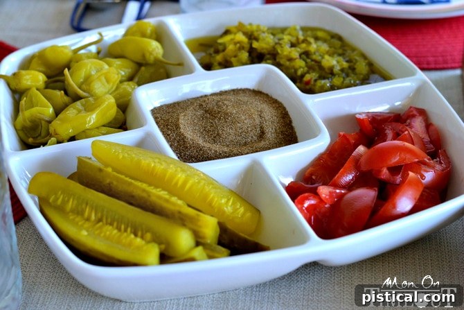 Assortment of vibrant toppings for Chicago-Style Hot Dogs, including relish, peppers, and tomatoes