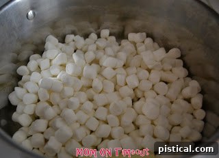 Sweetheart Popcorn Bites 5 Marshmallows and butter melting in a large pot for popcorn balls.