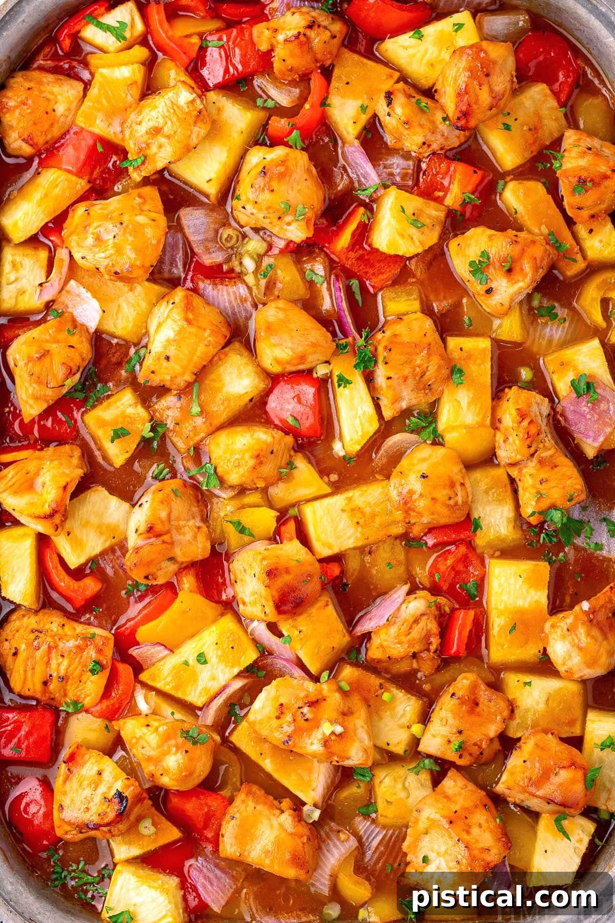 Pineapple Glazed Island Chicken 8 Hawaiian Chicken sheet pan recipe close up so you can see the glossy marinade and tender ingredients well.
