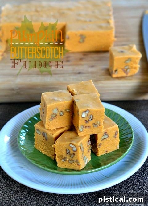 Close-up of a stack of freshly cut Butterscotch Pumpkin Fudge squares, showcasing the rich color and soft texture, ready to be enjoyed or shared.