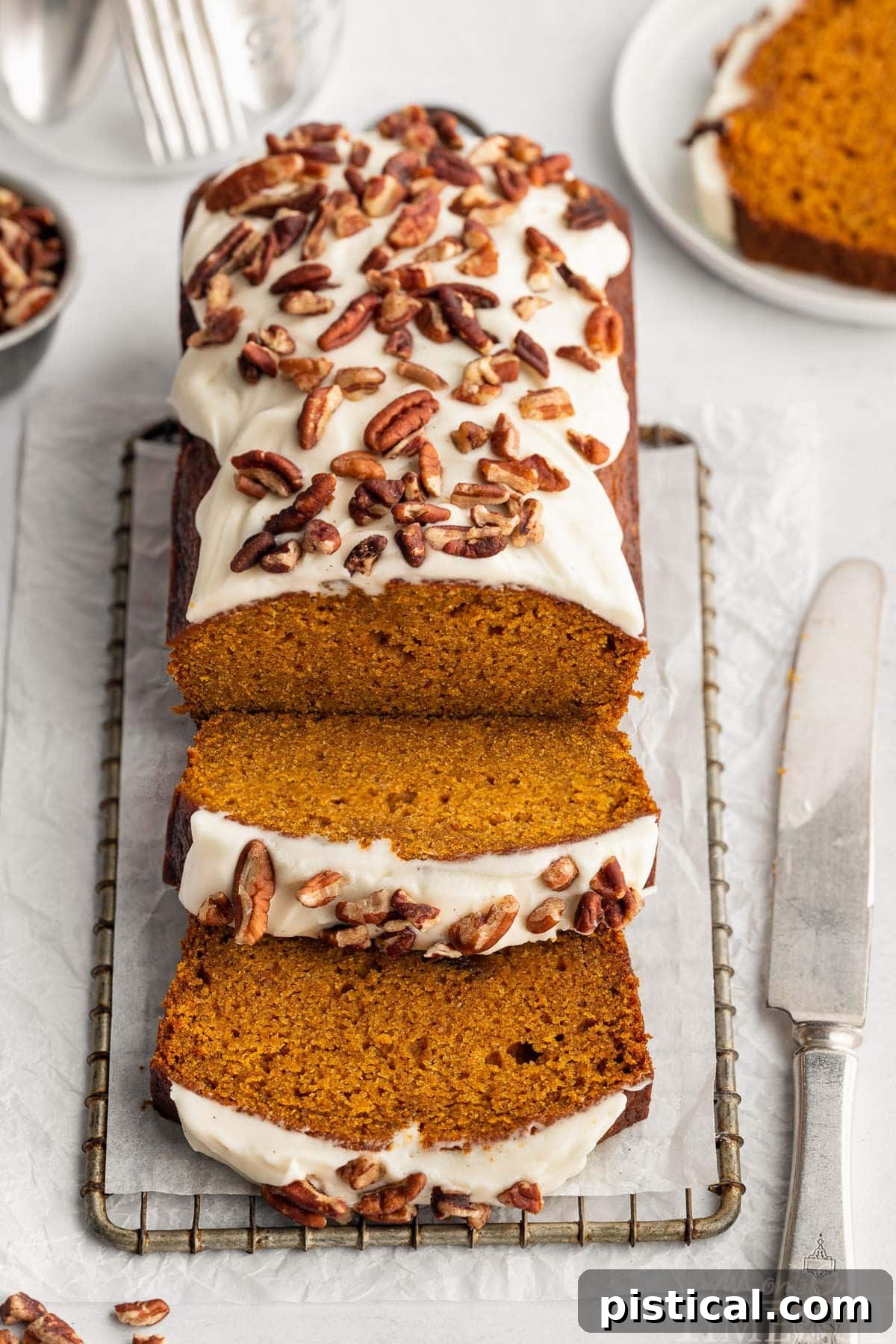 Top down look at pumpkin loaf with two slices cut.