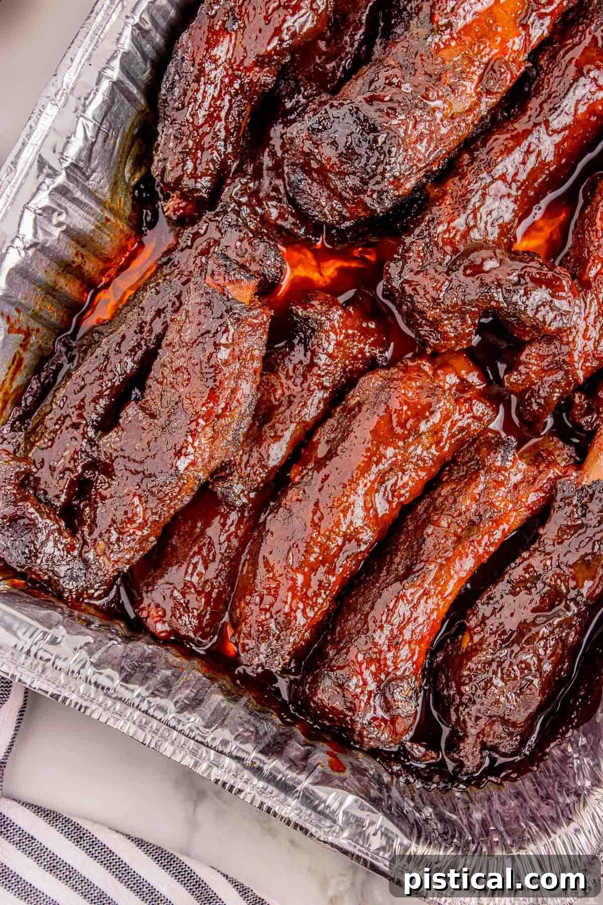 Overhead shot of party ribs in foil pan ready to serve.