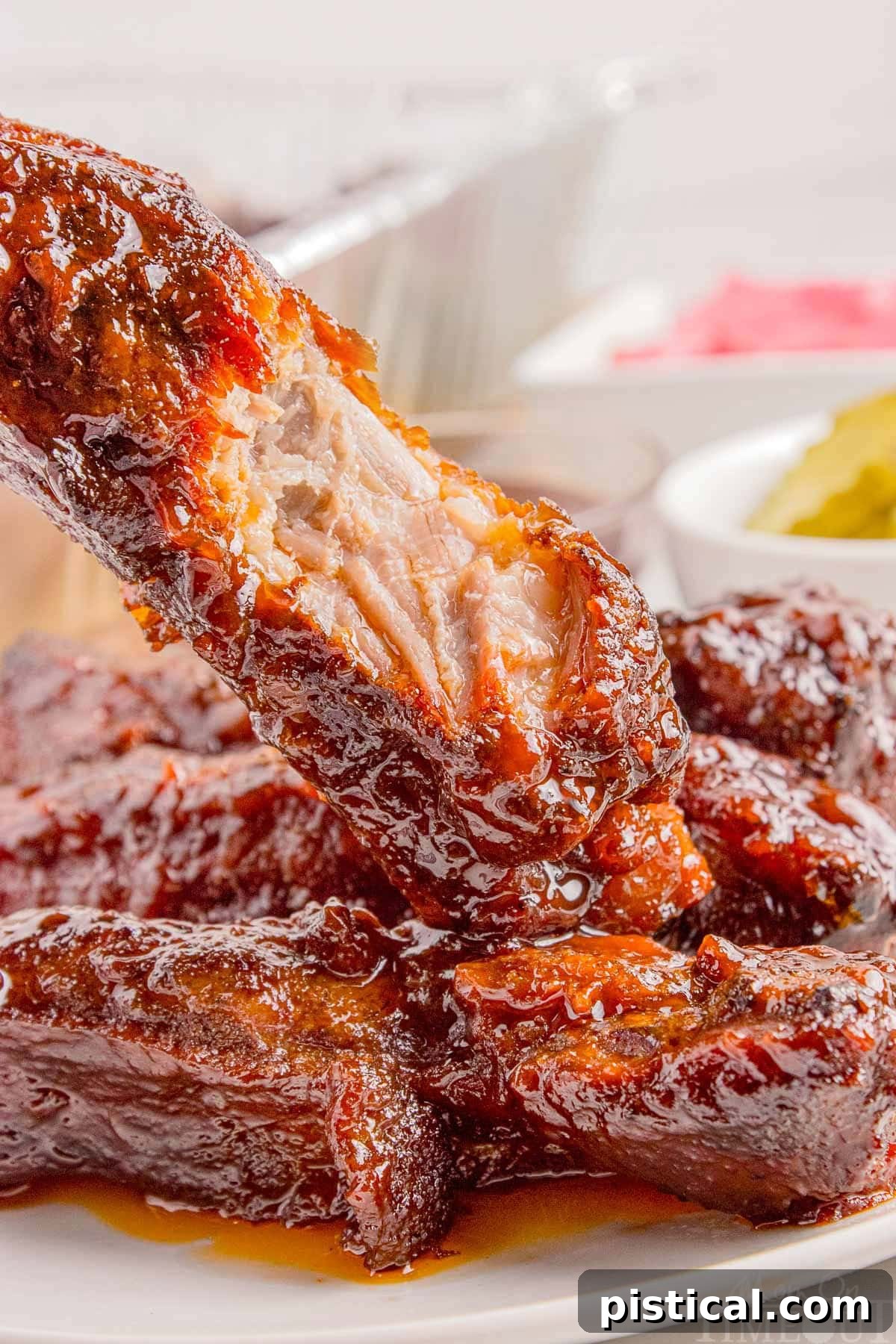 St Louis Pork Ribs with bite taken out of it. on plate.