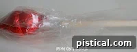 Stick inserted into the base of the cellophane-wrapped kisses
