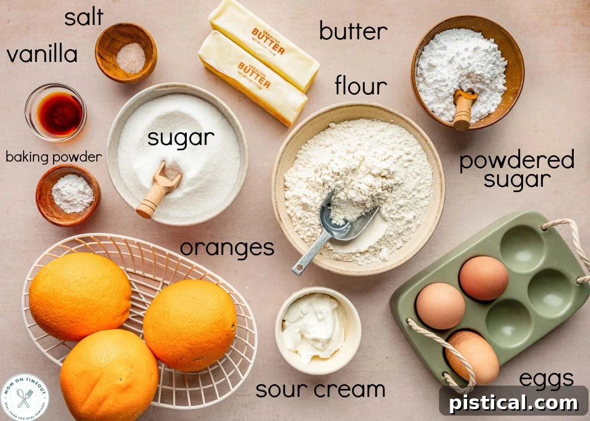 Zesty Orange Pound Cake 5 Overhead shot of orange pound cake ingredients measured out into small bowls ready to be used in the recipe.